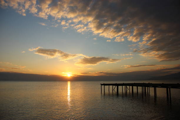 istock A pier and  beautiful sky with clouds at sunset 1743176571