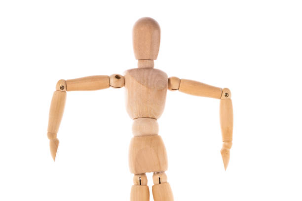 istock A wooden mannequin standing on a white surface. This versatile image can be used for various concepts and themes. 1743180247