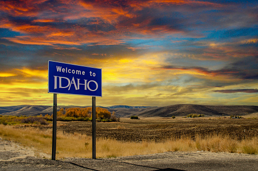 A Welcome to Idaho sign at the border of Idaho and Wyoming.