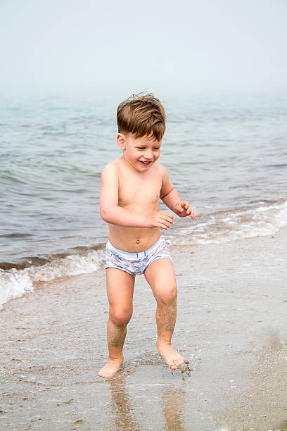istock Cute boy on sea beach 174318524