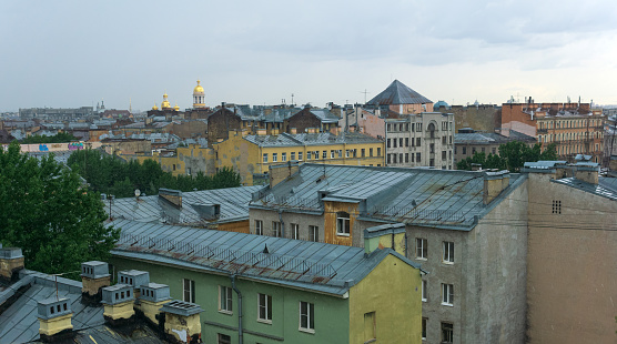 view of the roofs of the historical center of St. Petersburg on a cloudy day
