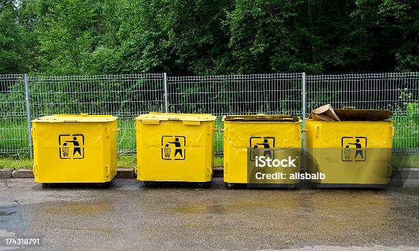 Four Old Yellow Trashcans Stock Photo - Download Image Now - Color Image, Environment, Europe