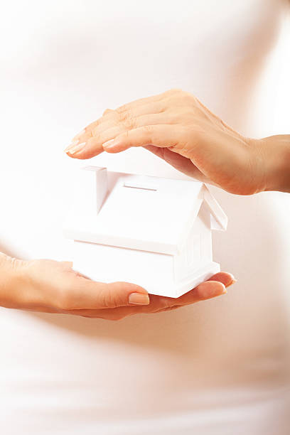 istock The house in human hands 174318880