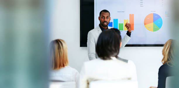 istock Business man, presentation portrait and screen for data analysis, pie chart proposal and infographics of revenue. Professional african person for financial report, charts and graphs or stats meeting 1743197568