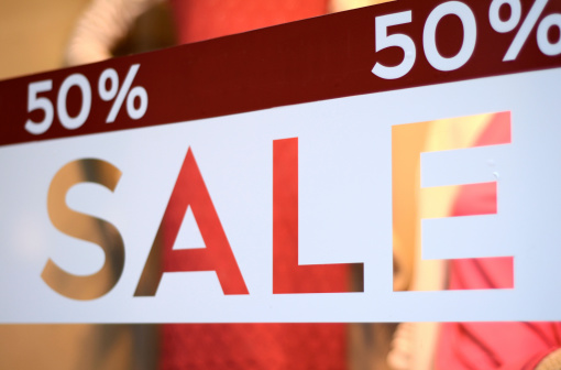 Retail Image Of A Sale Sign In A Clothing Store Window (With Shallow DoF)