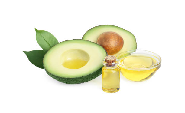 istock Essential oil and cut avocado on white background 1743258955