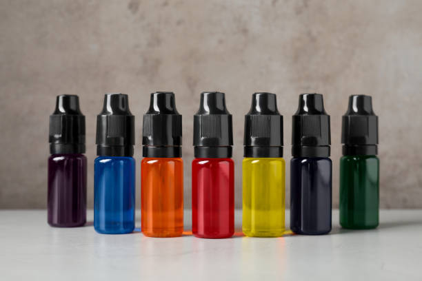 istock Bottles with different food coloring on white table 1743265934