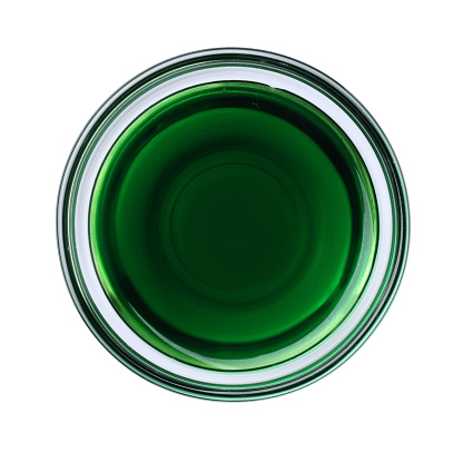 Glass bowl with green food coloring isolated on white, top view