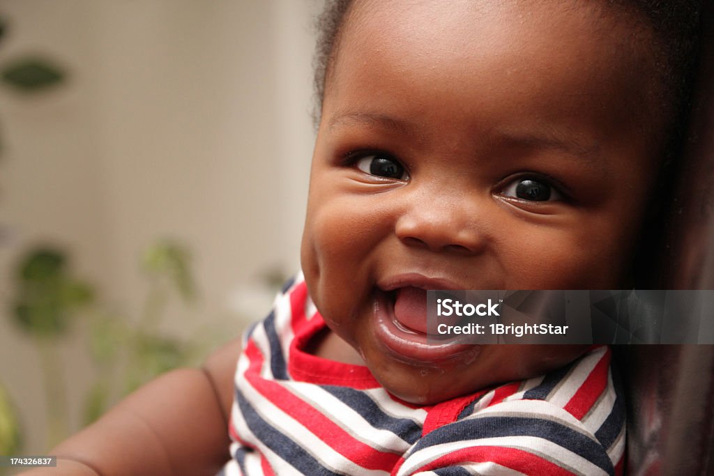 Baby Boy Smiling with Dimples Close up photo of baby boy smiling with dimples Baby - Human Age Stock Photo
