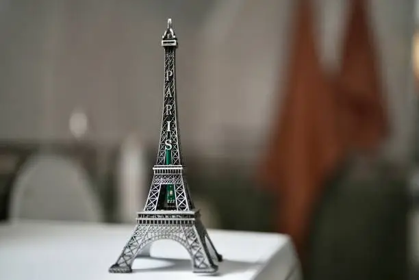 Photo of Beautiful Stylish Eiffel Tower of France Europe Model Statue Toy. The statuette of Eiffel of tower, Small bronze copy of Eiffel Towers,