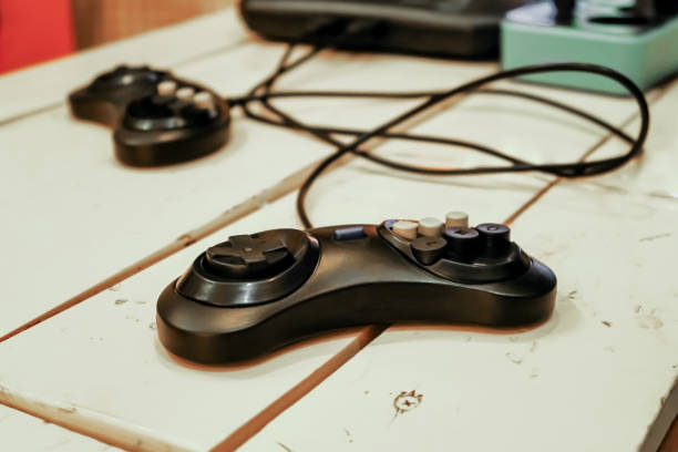 istock videogame joystick or gamepad on a vintage wooden table 1743283990