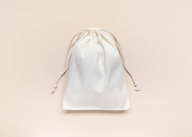 istock eco-friendly white cotton bag with ties on peach background 1743285054