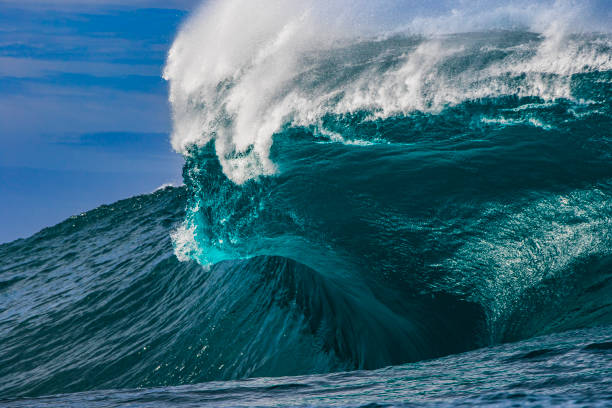 istock Big blue curved wave breaking in the open ocean over a shallow reef bombora 1743287155