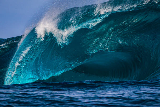 istock Big blue curved wave breaking in the open ocean over a shallow reef bombora 1743287162