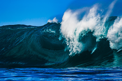 Close up of the crest of a large breaking wave