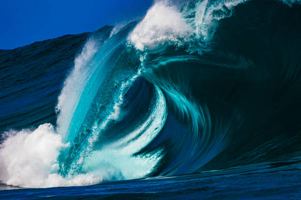 istock Big blue curved wave breaking in the open ocean over a shallow reef bombora 1743288218