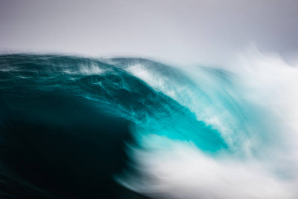istock Artistically captured blue curved wave breaking in the open ocean over a shallow reef bombora 1743288737