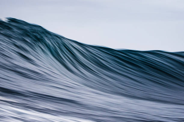 istock Artistically captured blue curved wave forming in the open ocean over a shallow reef bombora 1743288741