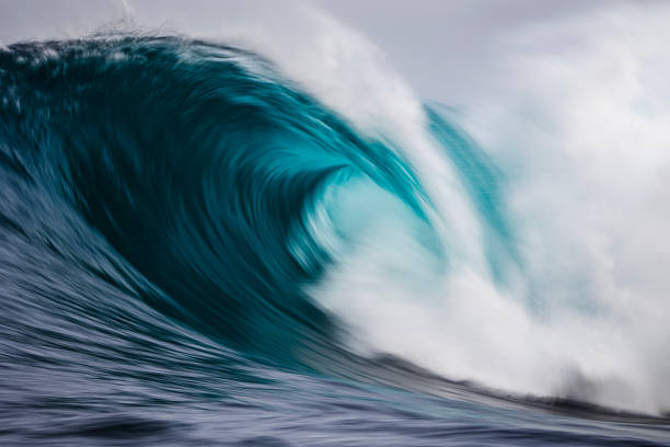 istock Artistically captured blue curved wave breaking in the open ocean over a shallow reef bombora 1743288748