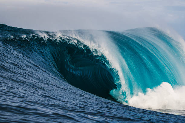 istock Big blue curved wave breaking in the open ocean over a shallow reef bombora 1743289282