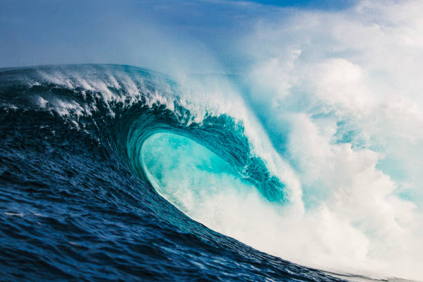 istock Big blue curved wave breaking in the open ocean over a shallow reef bombora 1743289535