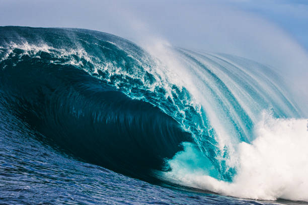 istock Big blue curved wave breaking in the open ocean over a shallow reef bombora 1743289810
