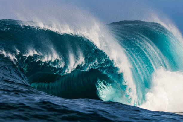 istock Big blue curved wave breaking in the open ocean over a shallow reef bombora 1743289816