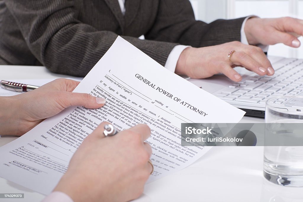 Hands of the woman signature document Hands of the woman signature document sitting on desk Abstract Stock Photo