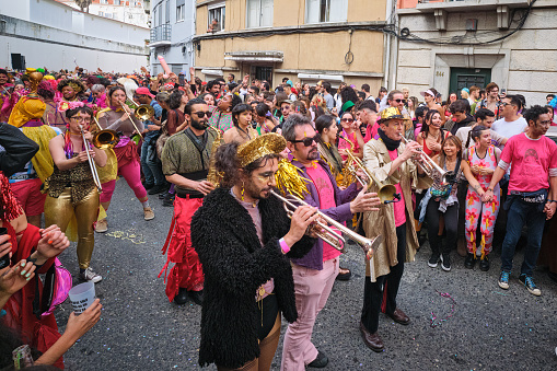Lisbon, Portugal - February 18, 2023: Carnival parade in streets of Lisbon by artistic collective Clandestine Colombina