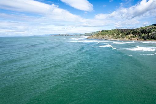 Great surf pouring into Makarori Beach, just north of Gisborne. Shot from above.