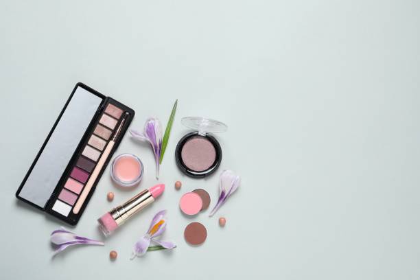istock Flat lay composition with eyeshadow palette and beautiful flowers on white background, space for text 1743340385