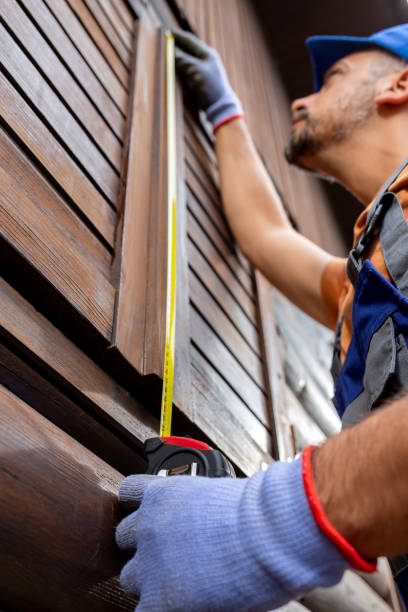 istock Professional using measure tape for window shutter replacement on wooden house. Home reparation concept. 1743344187