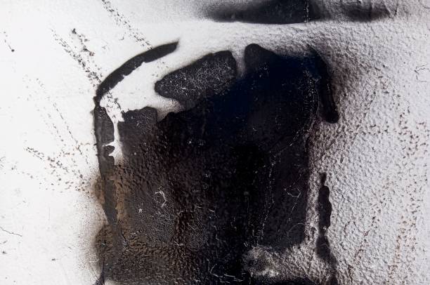 istock Dirty concrete cement wall with black stains. Abstract black paint grunge background. 1743348121