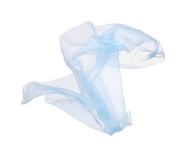 istock Beautiful light blue tulle fabric flying on white background 1743353121