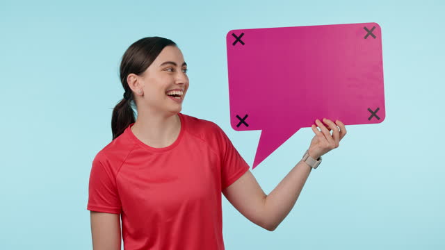 Happy, woman and face with speech bubble, chat and quote on social media in studio blue background. Athlete, portrait and sign with question, comment or voice online with feedback, faq or information