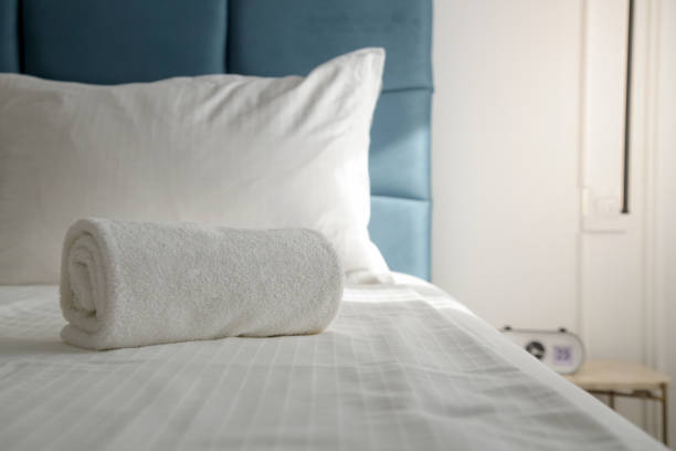istock Clean bath towel on bed in hotel suite 1743358673