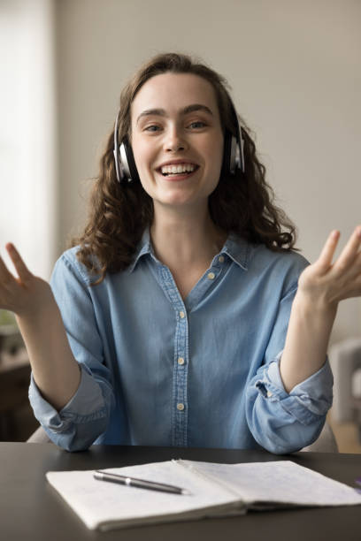 istock Cheerful gen Z student in headphones talking on video call 1743358764