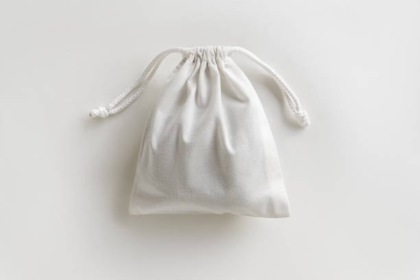istock eco-friendly white cotton bag with ties on white background 1743364683