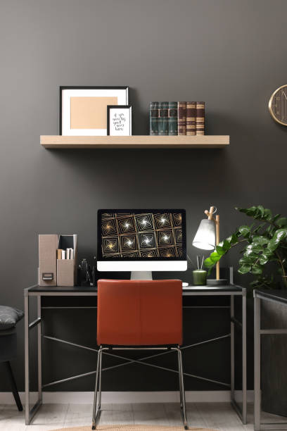 istock Cozy workspace with computer on metal desk at home 1743366465