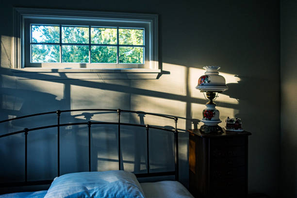 istock Late Afternoon Sunlight and Shadows in Dark Bedroom 1743383547