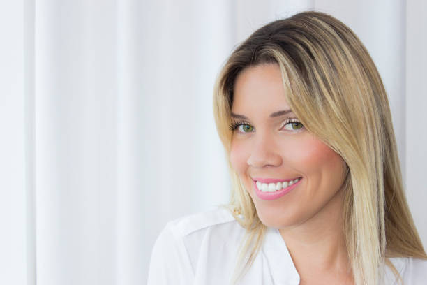 istock Beautiful young woman smiling 174338592