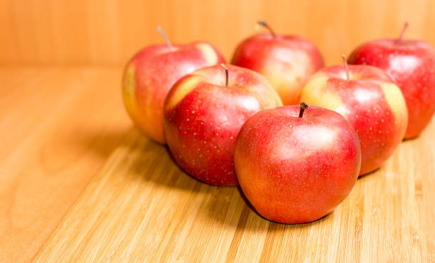 istock Fresh red apples on a wooden background 174339939