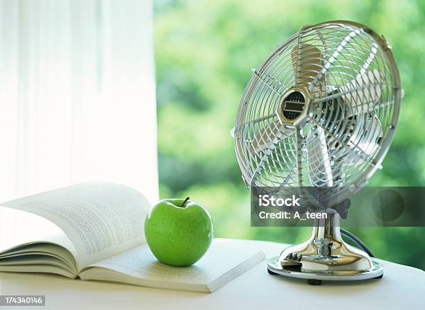 Electric Fan And Apple Stock Photo - Download Image Now - Electric Fan, Retro Style, Desk