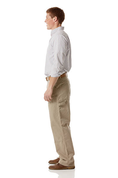 istock Side view of a young man posing against white 174341006
