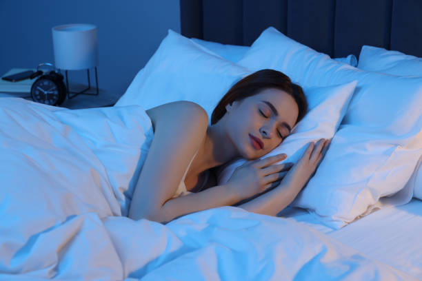 istock Beautiful young woman sleeping in bed at night 1743428523