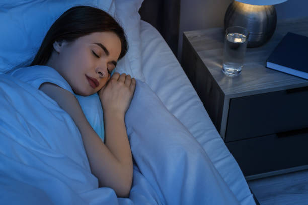 istock Beautiful young woman sleeping in bed at night 1743430343