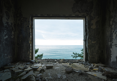 ruined apartment room with the sea window view