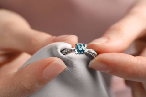 istock Jeweler cleaning topaz ring with microfiber cloth, closeup 1743461998