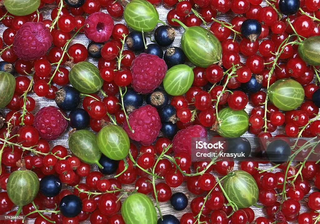 Mixed Berries background Mixed Berries background, on wood surface Backgrounds Stock Photo
