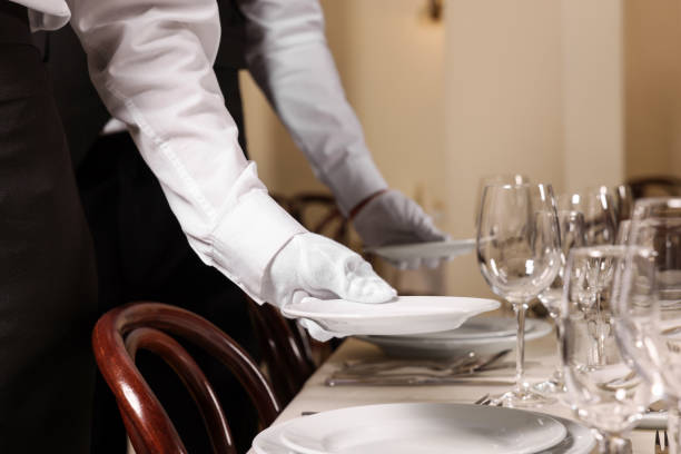 istock Woman setting table in restaurant, closeup. Professional butler courses 1743493871